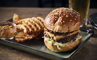 Burger and fries at Merchant & Trade